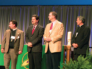 Rev. Dr. Al Collver (LCMS Director of Church Relations) stands with Rev. Peter Prange (Wisconsin Evangelical Lutheran Synod), Rev. Dr. Lawrence Welch (Roman Catholic Archdiocese of St. Louis), and Rev. David Wendel (North American Lutheran Church).