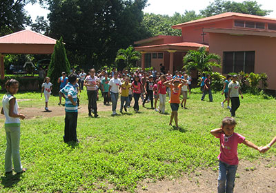 Children play in front of the Mission Centre in this file photo.