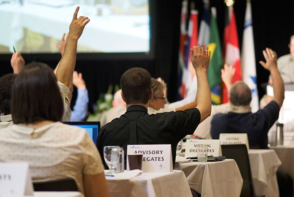 Delegates to the convention vote.