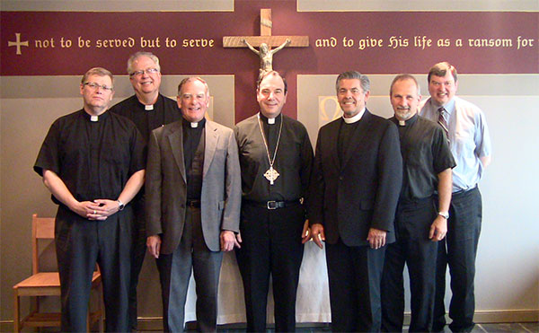 Rev. Phil Gagnon (NALC Provisional Dean for Canada); Rev. Larry Vogel (Associate Executive Secretary of the LCMS' CTCR); Rev. Mark Chavez (NALC General Secretary); Rev. Dr. Robert Bugbee (LCC President); Rev. Dr. David Wendel (NALC Assistant to the Bishop for Ministry and Ecumenism); Rev. Warren Hamp (Chairman of LCC's CTCR); Rev. Thomas Prachar (LCC Central District President).