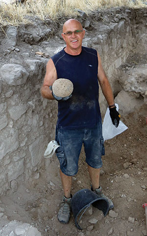 As missiles flew into Israel, members of the dig-team found evidence of older ballistic warfare.