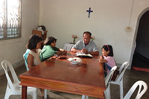 Praying together with Betty and her family.