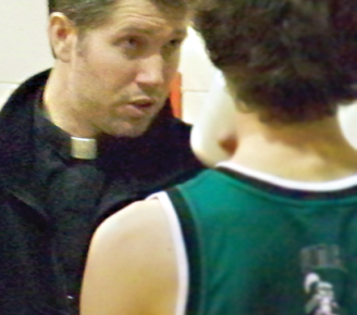 Pastor coaches, mentors and witnesses on the basketball court
