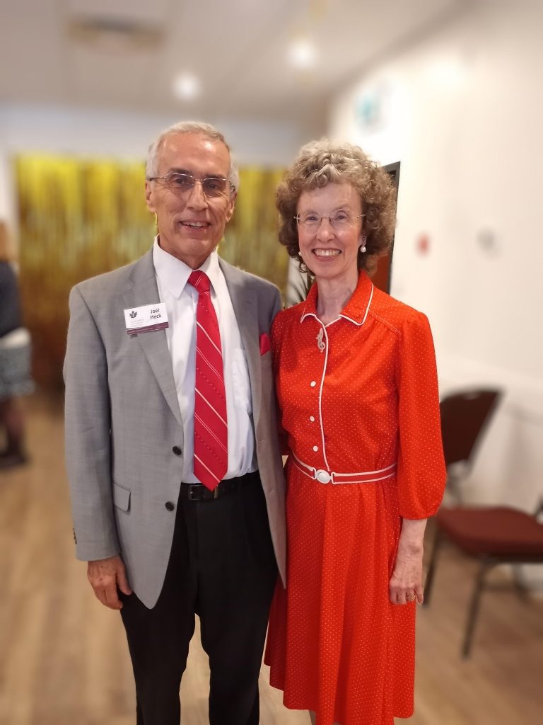 Dr. Joel Heck and his wife Cheryl standing together.