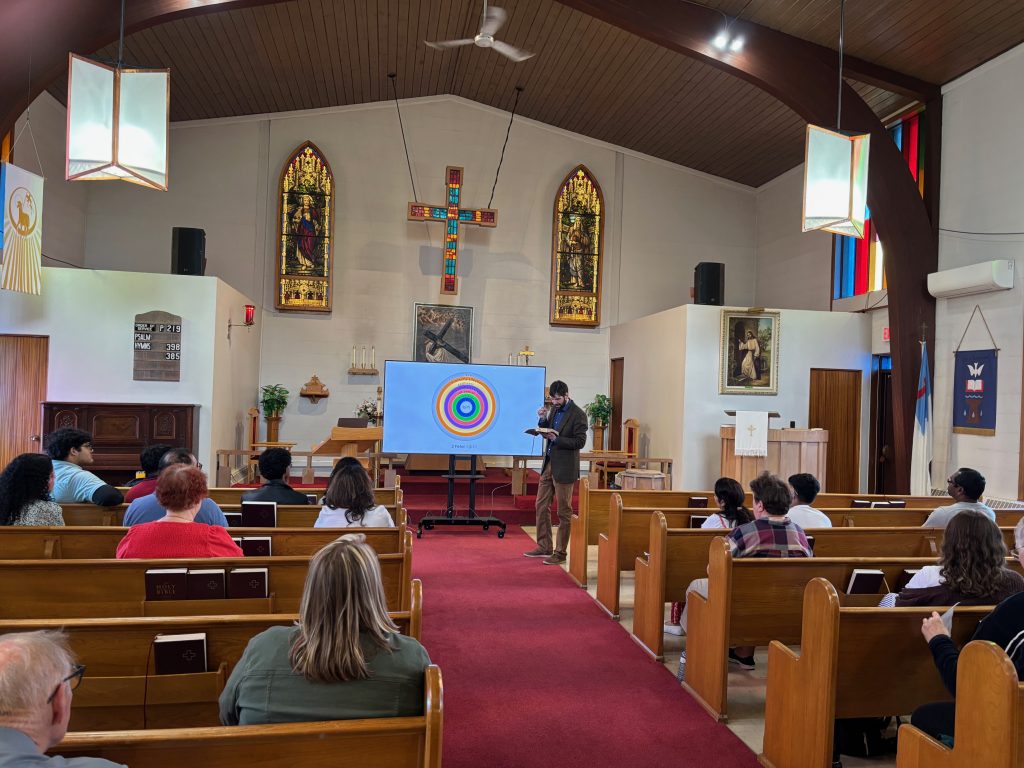 People gather in the church for a seminar.