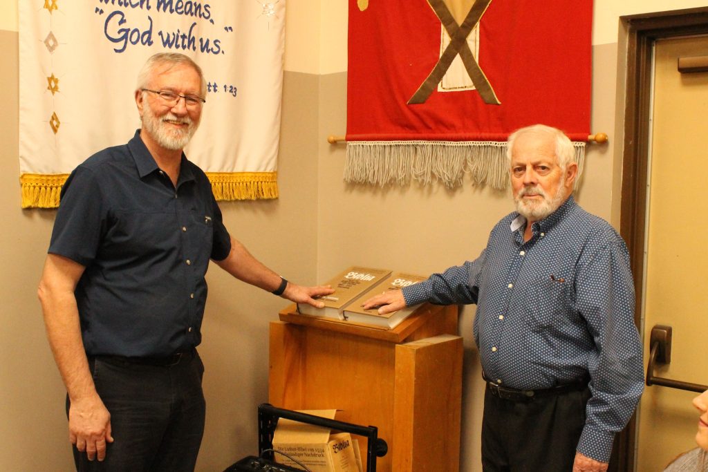 Hans Gust presenting to Jim Cartlidge (Saviour’s Executive Director) the facsimile of the 500-year-old Martin Luther translation of the Bible.