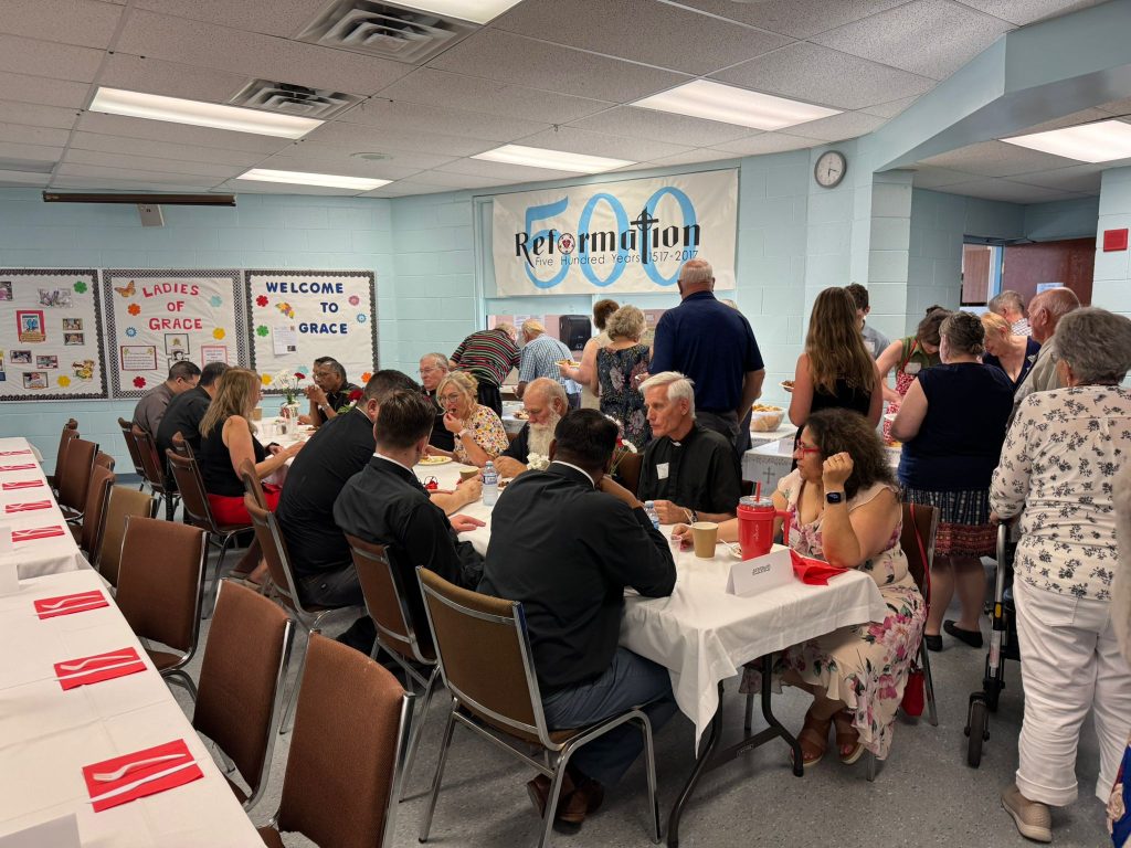 People gather for refreshments after the installation of Rev. Guntar Baikovs.