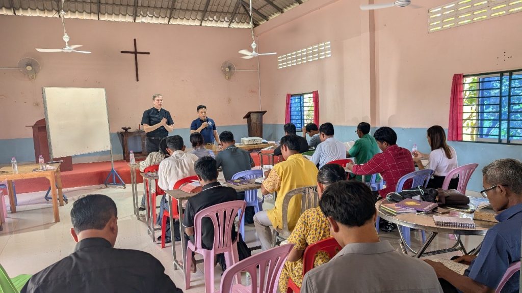 Pastor leading workshop at Evangelical Lutheran Mission Church in Kampong Thom.