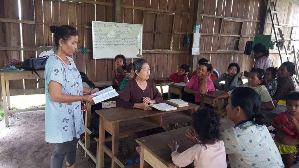 Deaconess teaching women and children.