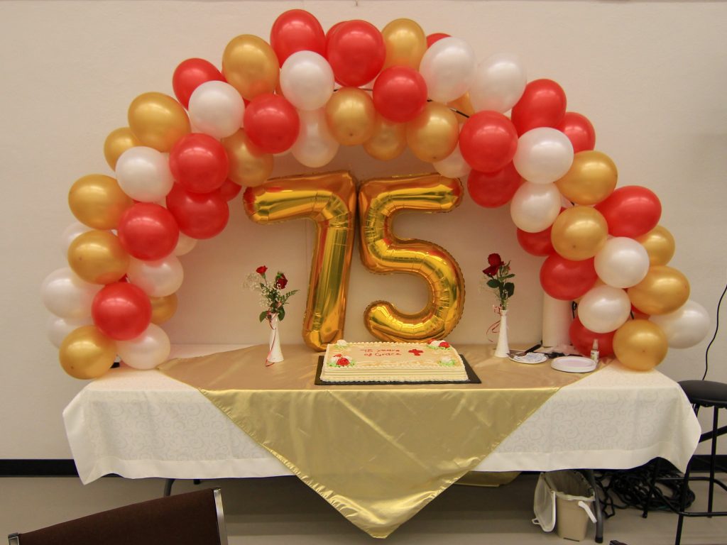 Balloons and cake to celebrate congregation's 75 anniversary.